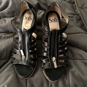 Black Wedges.  Good Condition but has a little wear on one heel. Leather
